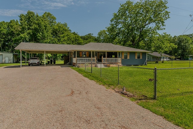 129 County Road 2063, Hull, TX 77564 - ranch-style house featuring driveway and covered porch