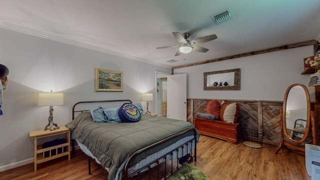 129 County Road 2063, Hull, TX 77564 - bedroom featuring crown molding, wood finished floors, baseboards, and a ceiling fan