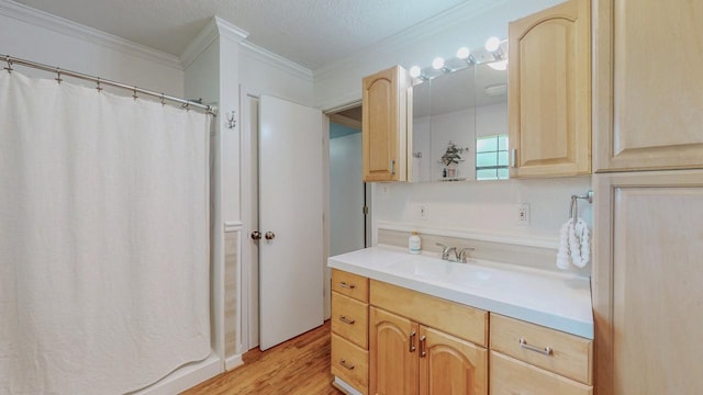 129 County Road 2063, Hull, TX 77564 - full bath with ornamental molding, wood finished floors, vanity, and curtained shower
