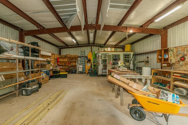129 County Road 2063, Hull, TX 77564 - garage featuring a workshop area and metal wall