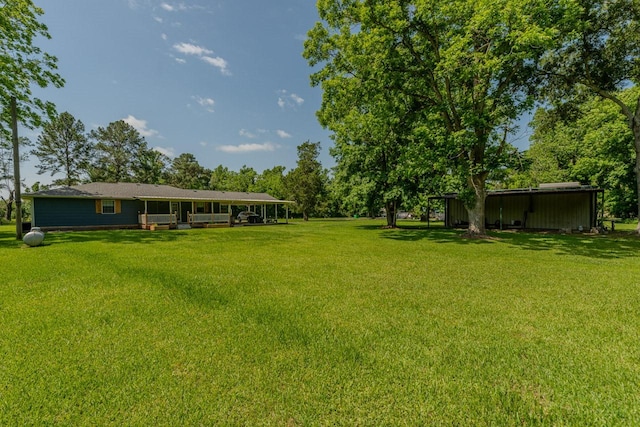 129 County Road 2063, Hull, TX 77564 - view of grassy yard