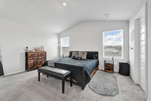 1325 Rd 5102, Cleveland, TX 77327 - bedroom featuring vaulted ceiling, carpet floors, baseboards, and a textured ceiling