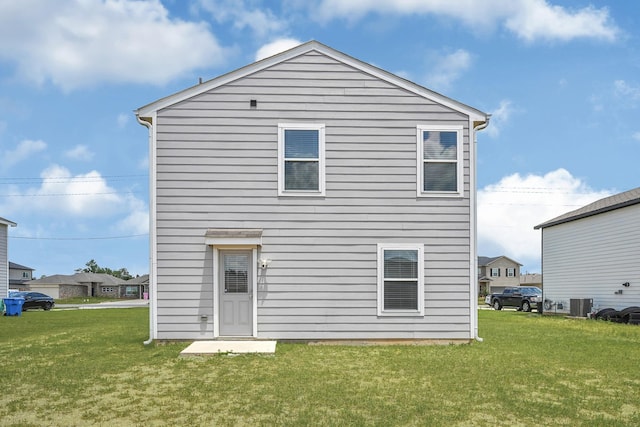 1325 Rd 5102, Cleveland, TX 77327 - rear view of house with a yard and central AC