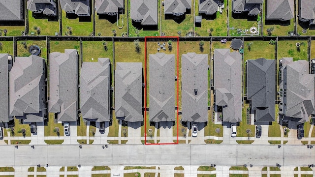 aerial view of residential area with property boundaries highlighted