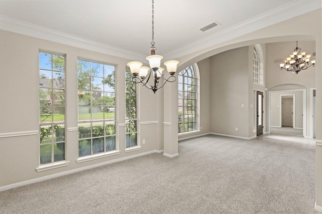 unfurnished dining area with a chandelier, plenty of natural light, crown molding, and carpet flooring