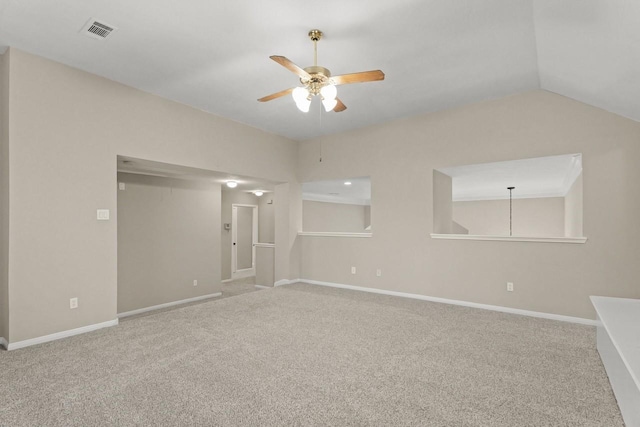 carpeted spare room featuring ceiling fan, baseboards, and lofted ceiling