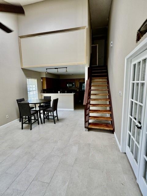 11957 Bob White Dr Unit 863, Houston, TX 77035 - stairway with rail lighting and baseboards