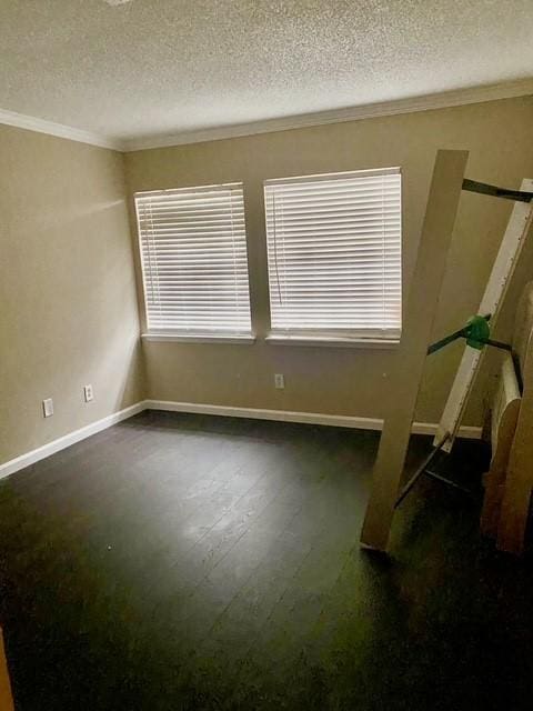 11957 Bob White Dr Unit 863, Houston, TX 77035 - empty room with crown molding, a textured ceiling, baseboards, plenty of natural light, and wood finished floors