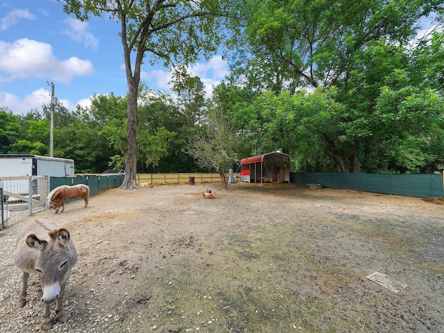 29 County Road 2131 Unit A, Cleveland, TX 77327 - view of yard with an outdoor structure and an exterior structure