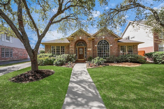 1119 Summer Brk, Sugar Land, TX 77479 - traditional home featuring brick siding and a front lawn