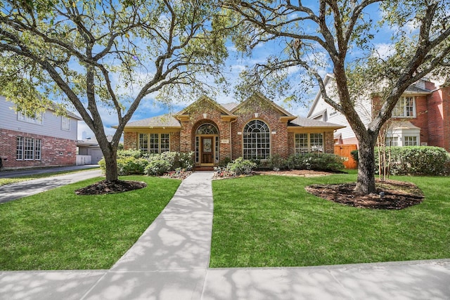1119 Summer Brk, Sugar Land, TX 77479 - traditional home with brick siding and a front lawn