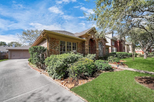 1119 Summer Brk, Sugar Land, TX 77479 - view of front of property featuring brick siding, a garage, concrete driveway, a front yard, and roof with shingles
