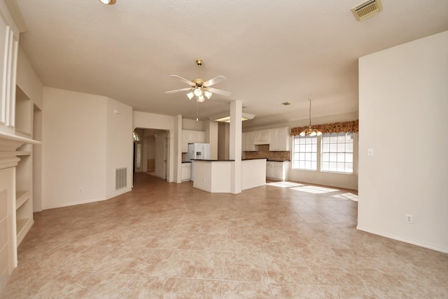 1119 Summer Brk, Sugar Land, TX 77479 - unfurnished living room with a ceiling fan, a chandelier, and baseboards