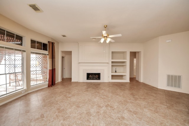 1119 Summer Brk, Sugar Land, TX 77479 - unfurnished living room with ceiling fan, built in shelves, a fireplace, light tile patterned flooring, and baseboards