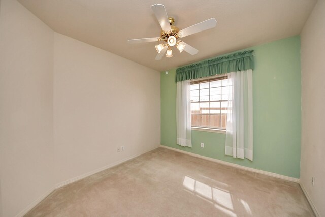 1119 Summer Brk, Sugar Land, TX 77479 - spare room featuring light carpet, ceiling fan, and baseboards