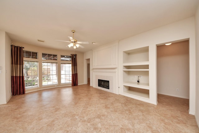 1119 Summer Brk, Sugar Land, TX 77479 - unfurnished living room featuring built in shelves, ceiling fan, a fireplace, baseboards, and light tile patterned floors