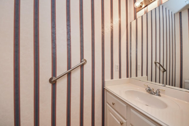 1119 Summer Brk, Sugar Land, TX 77479 - bathroom with vanity, wallpapered walls, and toilet