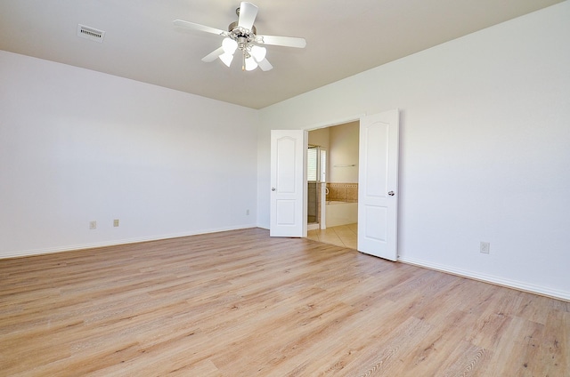 unfurnished room with light wood finished floors, ceiling fan, and baseboards