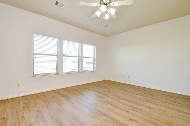 unfurnished room featuring wood finished floors and baseboards