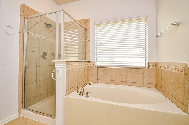 full bathroom featuring a stall shower and a bath