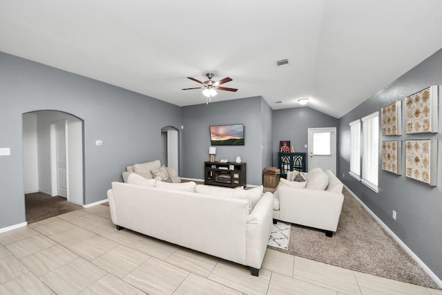 7215 Cypress Pin Oak Dr, Cypress, TX 77433 - living area featuring arched walkways, ceiling fan, vaulted ceiling, baseboards, and light tile patterned floors