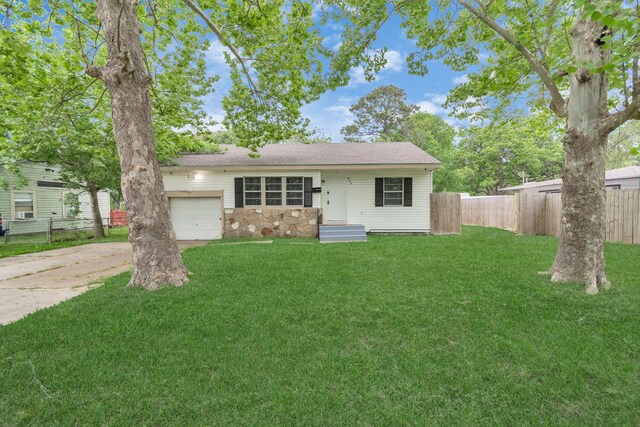 602 Bluebonnet Dr, La Marque, TX 77568 - view of front facade featuring concrete driveway, an attached garage, and stone siding