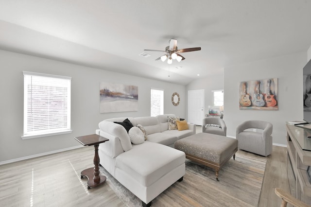 8230 Red Spruce St, Magnolia, TX 77354 - living room featuring light wood-style floors, ceiling fan, baseboards, and lofted ceiling