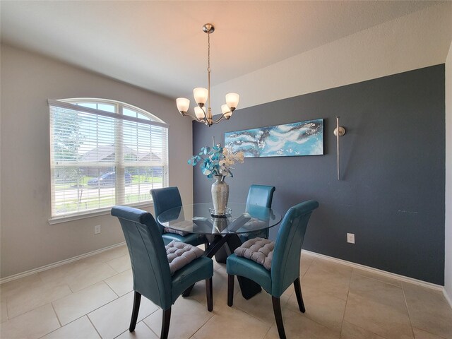 4931 Marina Shores Ct, Katy, TX 77493 - dining room featuring a chandelier, baseboards, and light tile patterned flooring