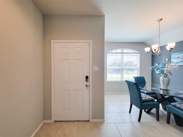 4931 Marina Shores Ct, Katy, TX 77493 - dining space with a chandelier, light tile patterned flooring, baseboards, and lofted ceiling