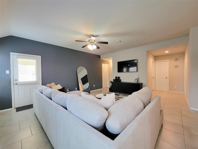 4931 Marina Shores Ct, Katy, TX 77493 - living area featuring light tile patterned flooring, ceiling fan, lofted ceiling, and baseboards