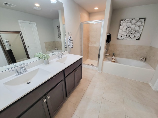 4931 Marina Shores Ct, Katy, TX 77493 - bathroom with a shower stall, a bath, tile patterned flooring, double vanity, and recessed lighting