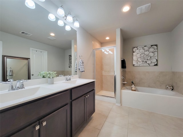 4931 Marina Shores Ct, Katy, TX 77493 - full bathroom featuring tile patterned flooring, a stall shower, a bath, double vanity, and recessed lighting
