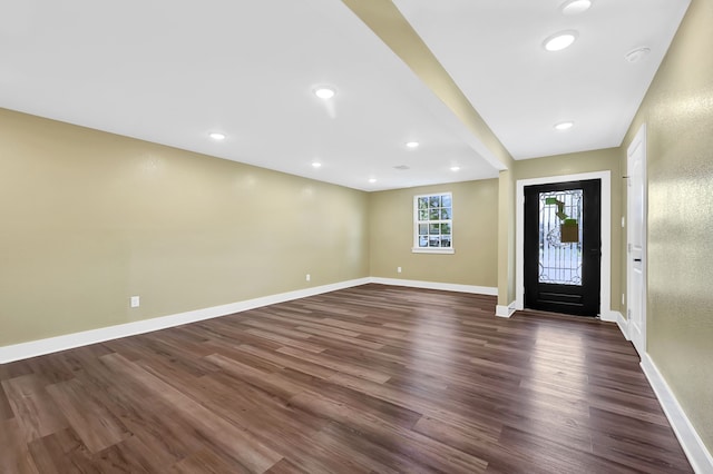 entrance foyer featuring dark wood-style floors, baseboards, and recessed lighting