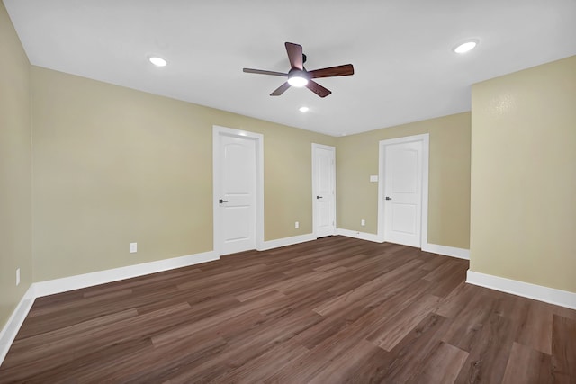 unfurnished bedroom with dark wood finished floors, baseboards, a ceiling fan, and recessed lighting