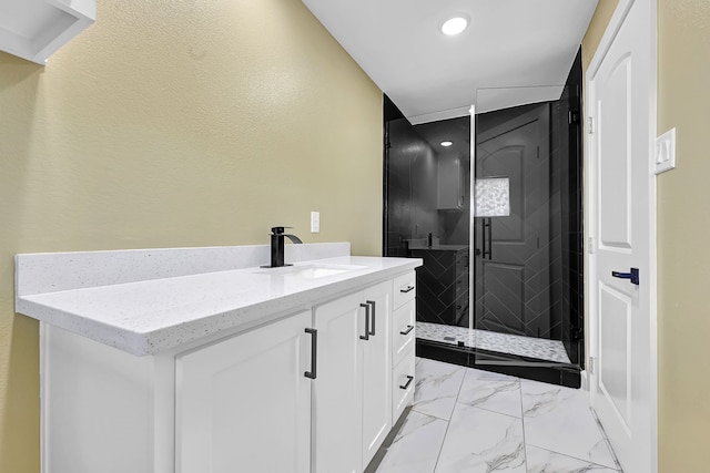 bathroom with a stall shower, vanity, recessed lighting, and marble look tile flooring