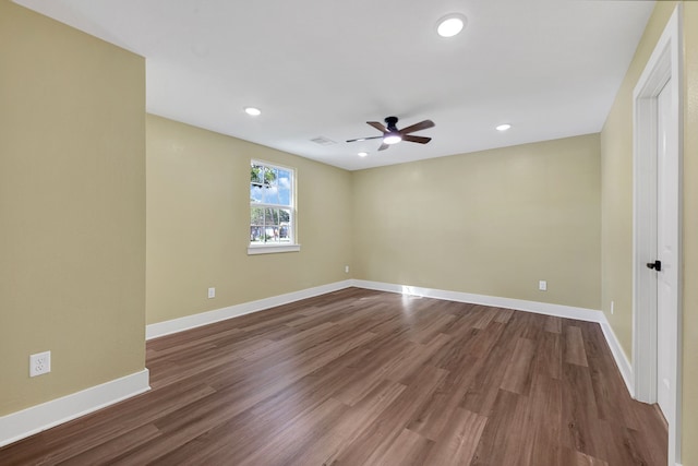 empty room featuring ceiling fan, dark wood-type flooring, baseboards, and recessed lighting