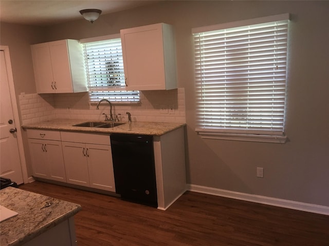 kitchen featuring dishwasher, a sink, white cabinetry, dark wood finished floors, and decorative backsplash