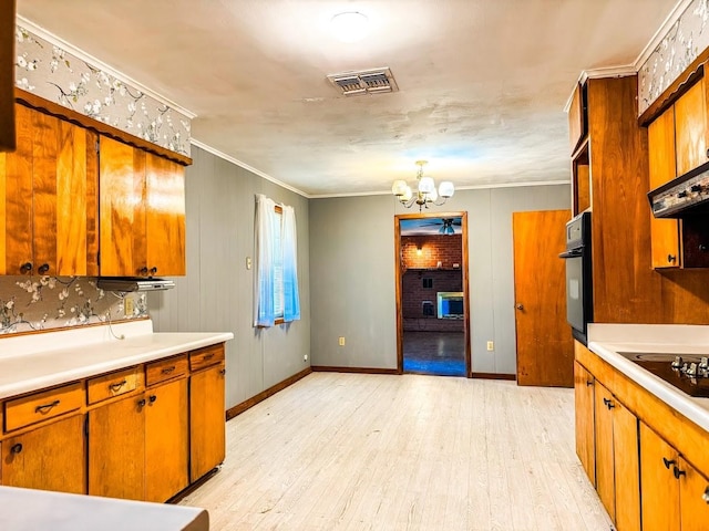 1085 Duke Rd, Kennard, TX 75847 - kitchen featuring black appliances, a chandelier, light wood-style floors, light countertops, and crown molding