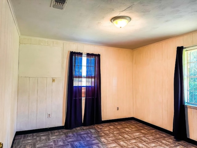 1085 Duke Rd, Kennard, TX 75847 - spare room with wood walls and baseboards
