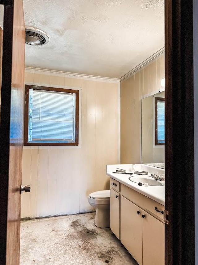 1085 Duke Rd, Kennard, TX 75847 - half bathroom with toilet, vanity, and ornamental molding