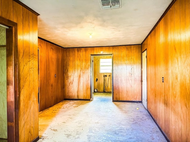 1085 Duke Rd, Kennard, TX 75847 - unfurnished room with wooden walls and concrete flooring