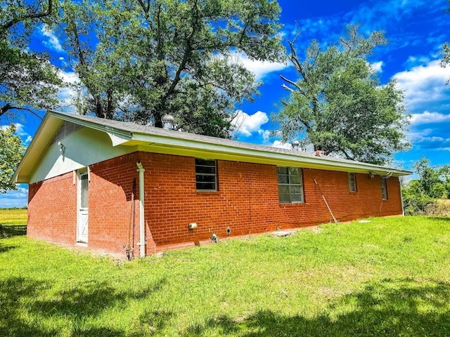 1085 Duke Rd, Kennard, TX 75847 - view of side of property featuring a lawn and brick siding