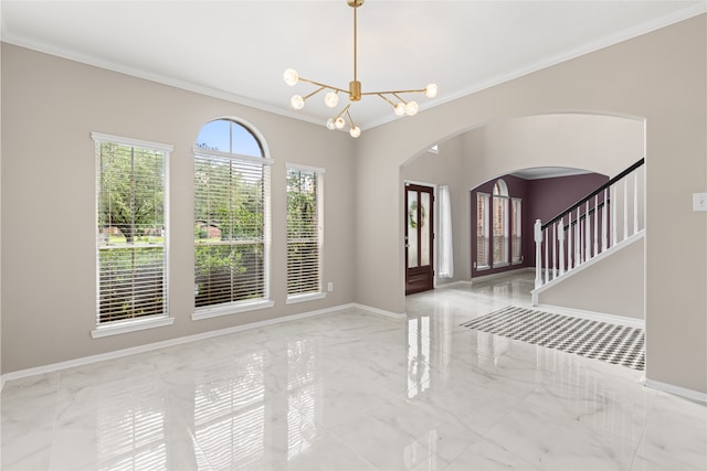 20106 Pinehaven Ln, Spring, TX 77379 - foyer with marble tiled floors, crown molding, arched walkways, a chandelier, and baseboards