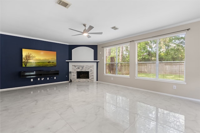 20106 Pinehaven Ln, Spring, TX 77379 - unfurnished living room with marble tiled floors, ornamental molding, a ceiling fan, and plenty of natural light
