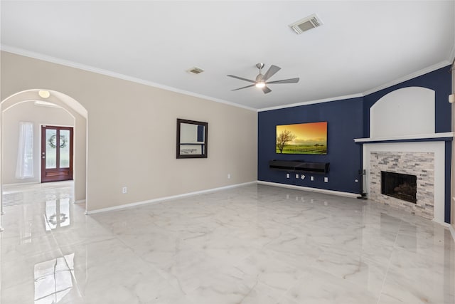 20106 Pinehaven Ln, Spring, TX 77379 - unfurnished living room featuring a ceiling fan, crown molding, marble finish flooring, a stone fireplace, and baseboards