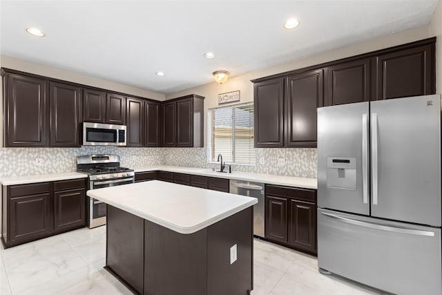 20106 Pinehaven Ln, Spring, TX 77379 - kitchen featuring stainless steel appliances, light marble finish floors, dark brown cabinets, light countertops, and recessed lighting