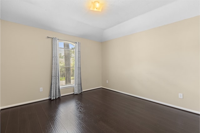 20106 Pinehaven Ln, Spring, TX 77379 - empty room with dark wood-style flooring, baseboards, and vaulted ceiling