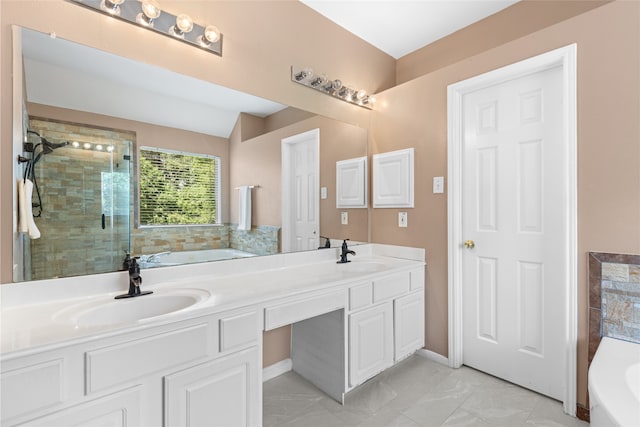20106 Pinehaven Ln, Spring, TX 77379 - bathroom with a bath, double vanity, a shower stall, and baseboards