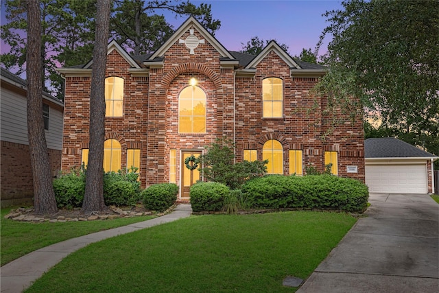 20106 Pinehaven Ln, Spring, TX 77379 - traditional home featuring brick siding, a yard, and concrete driveway