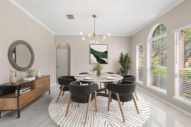 20106 Pinehaven Ln, Spring, TX 77379 - dining room with ornamental molding, a chandelier, arched walkways, and baseboards